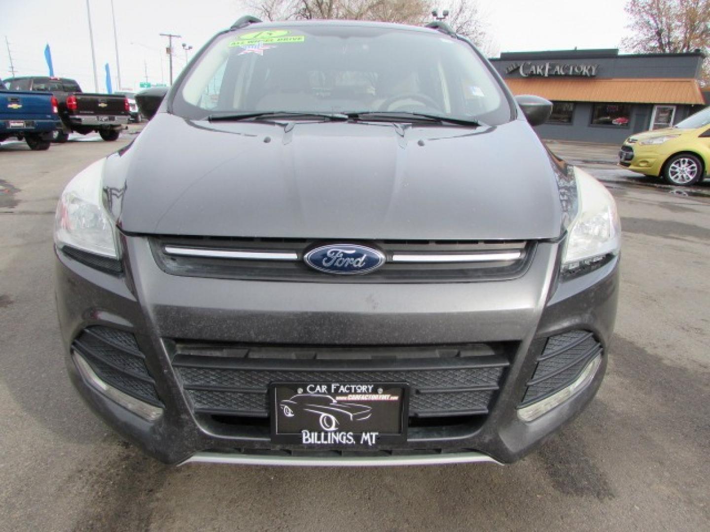 2015 Gray /Tan Ford Escape SE (1FMCU9G96FU) with an 2.0 I4 Ecoboost turbo engine engine, 6 speed automatic transmission, located at 4562 State Avenue, Billings, MT, 59101, (406) 896-9833, 45.769516, -108.526772 - 2015 Ford Escape SE 4WD 2.0 Ecoboost Turbo 4 cylinder engine - 6 speed automatic transmission - 4WD - 151,468 miles $256 per month - payment example based on $1000 cash or trade down - 36 months at 7.99 percent APR - on approved credit SE package - air conditioning - tilt and steering wheel - Photo#5